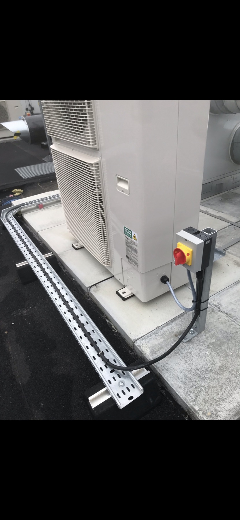 Local electrical isolator and cable tray beside plant equipment